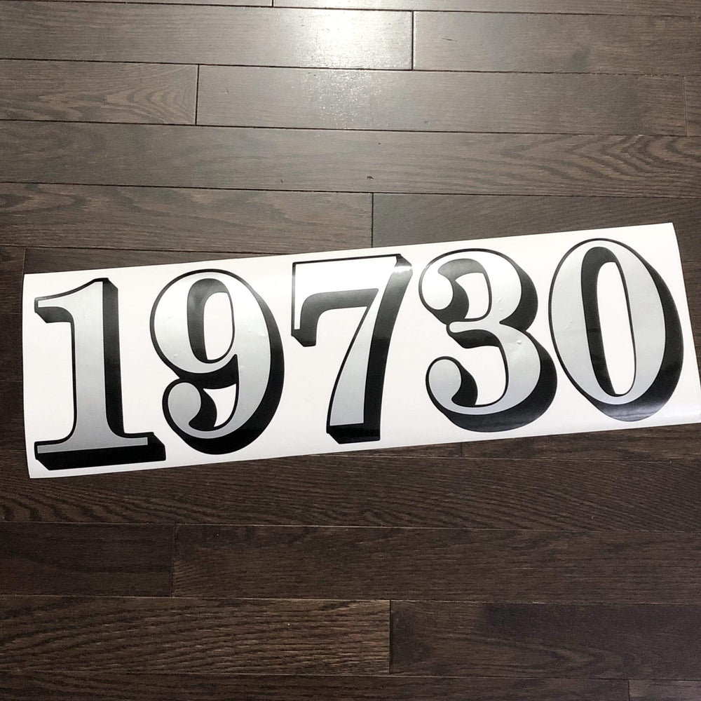 Reflective outlined 19730 number decal on backing