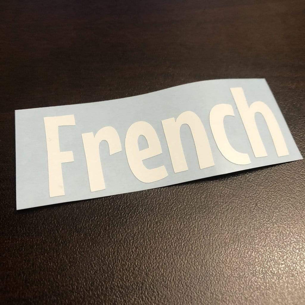 White French lettering on a backing sheet