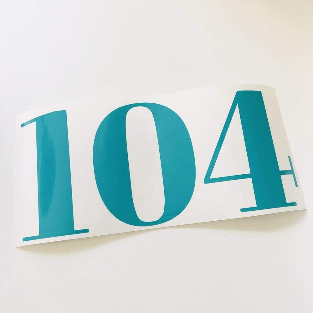 Teal 104 number decal on white backing