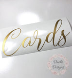 Gold-coloured Cards script decal on backing