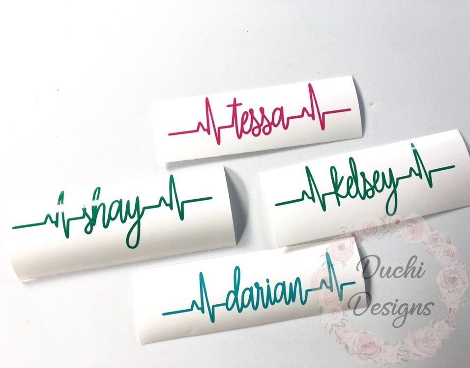 Pink and green heartbeat name decals on backing paper