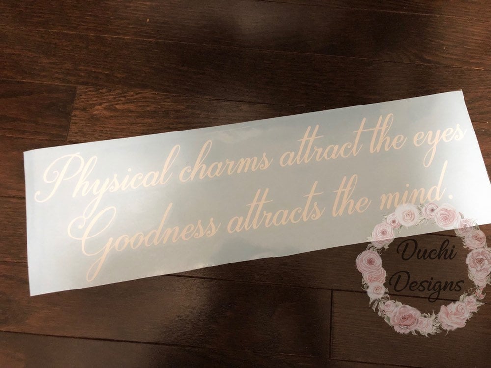 White Physical charms attract the eyes quote on backing