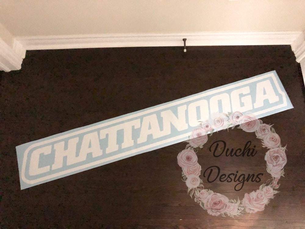 White outlined Chattanooga lettering on blue backing