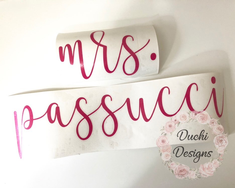 Pink Mrs. Passucci script name decals on curved backing