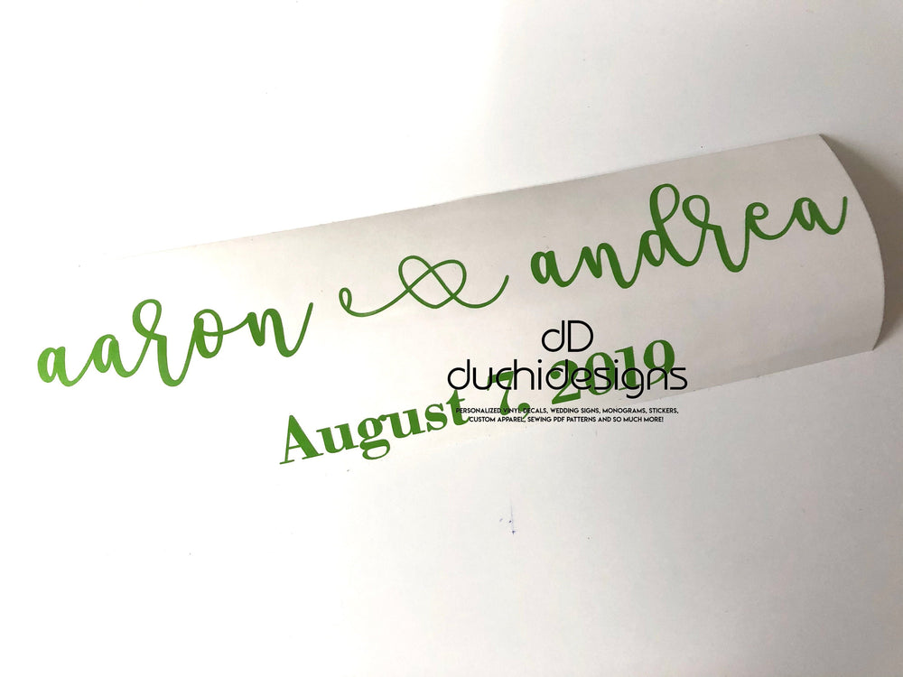 Green Aaron and Andrea names with wedding date on backing
