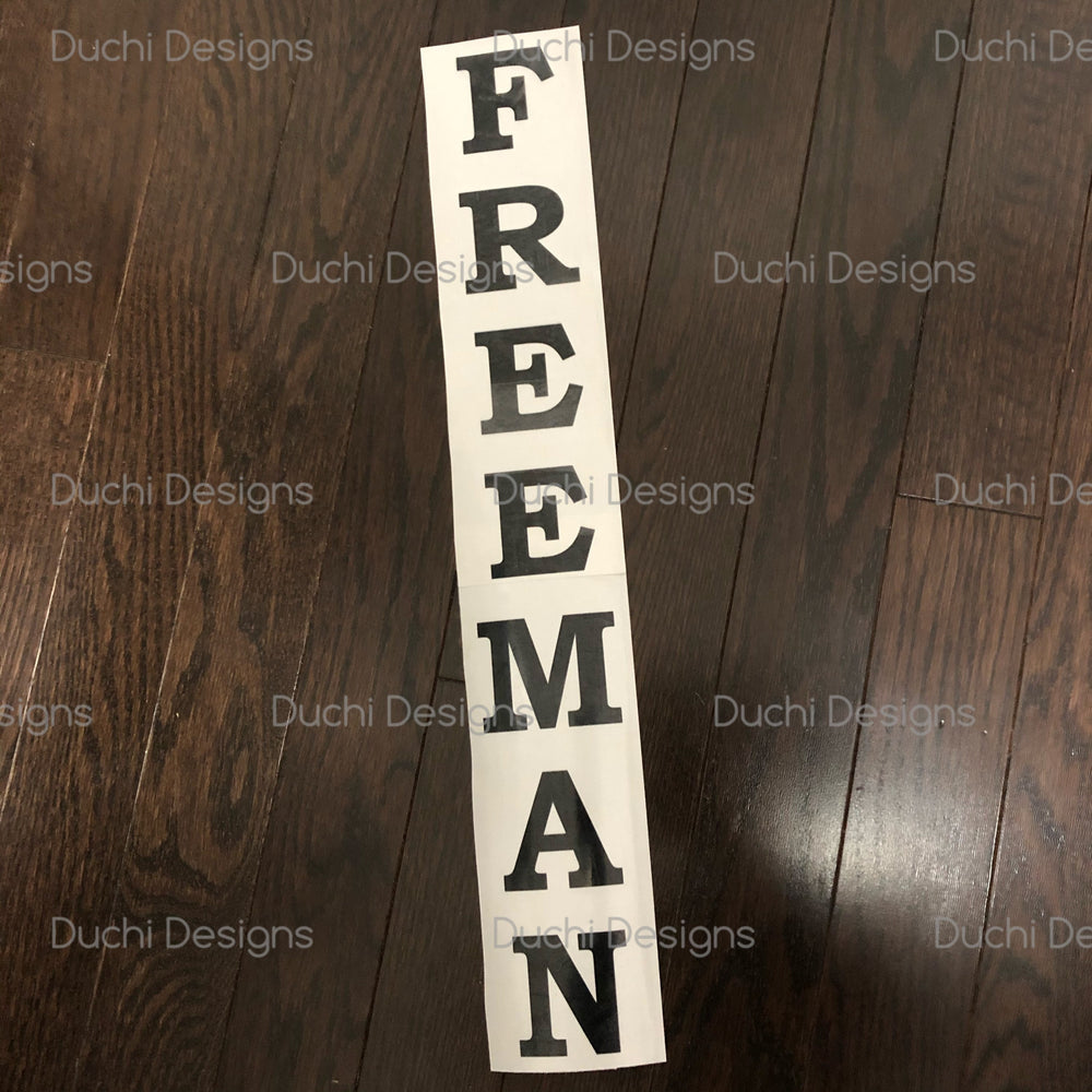 Black FREEMAN name stacked vertically