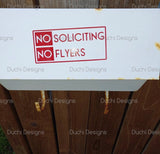 Red No Soliciting No Flyers lettering laid on backing