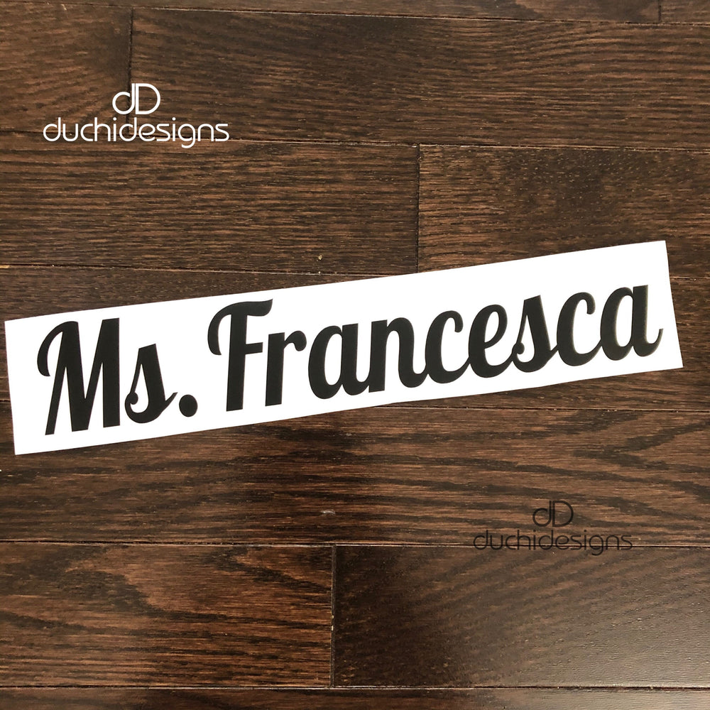 Black Ms. Francesca script lettering on backing