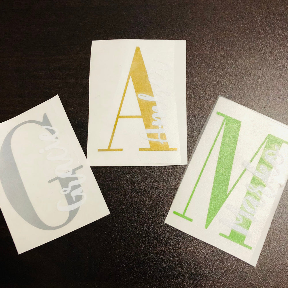 Grey, gold-coloured and green split-monogram decals