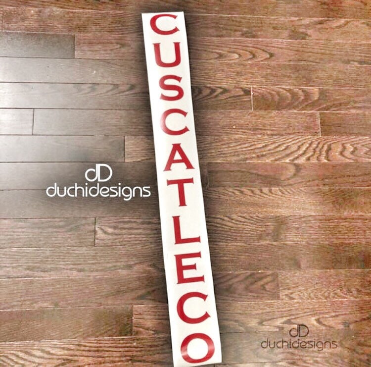Red CUSCATLECO vertical lettering strip