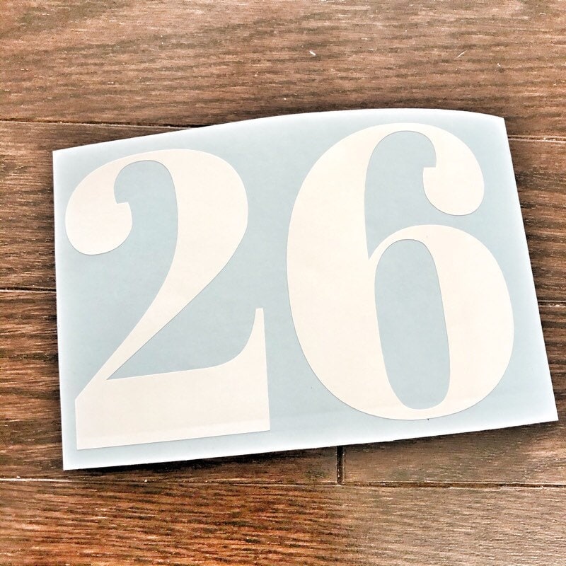 White 26 two-digit decal on blue backing