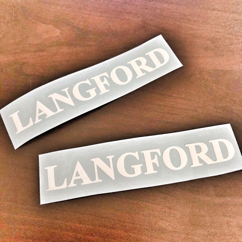 Two white Langford name decals on grey backing