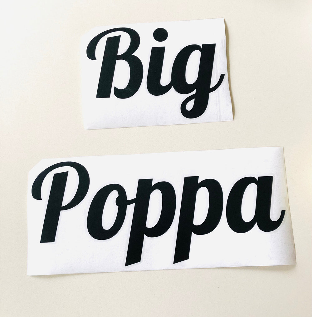 Black Big Poppa lettering on two backing sheets
