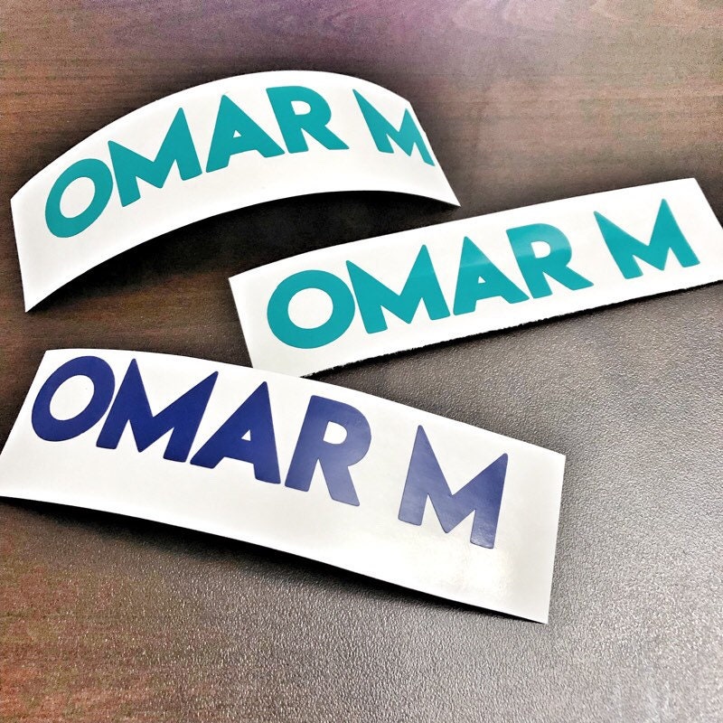 Omar M name decals in teal and blue