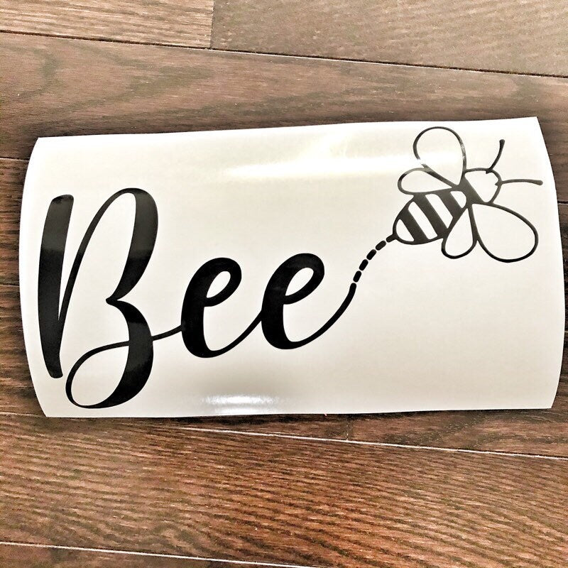 Black Bee lettering with a bee outline design