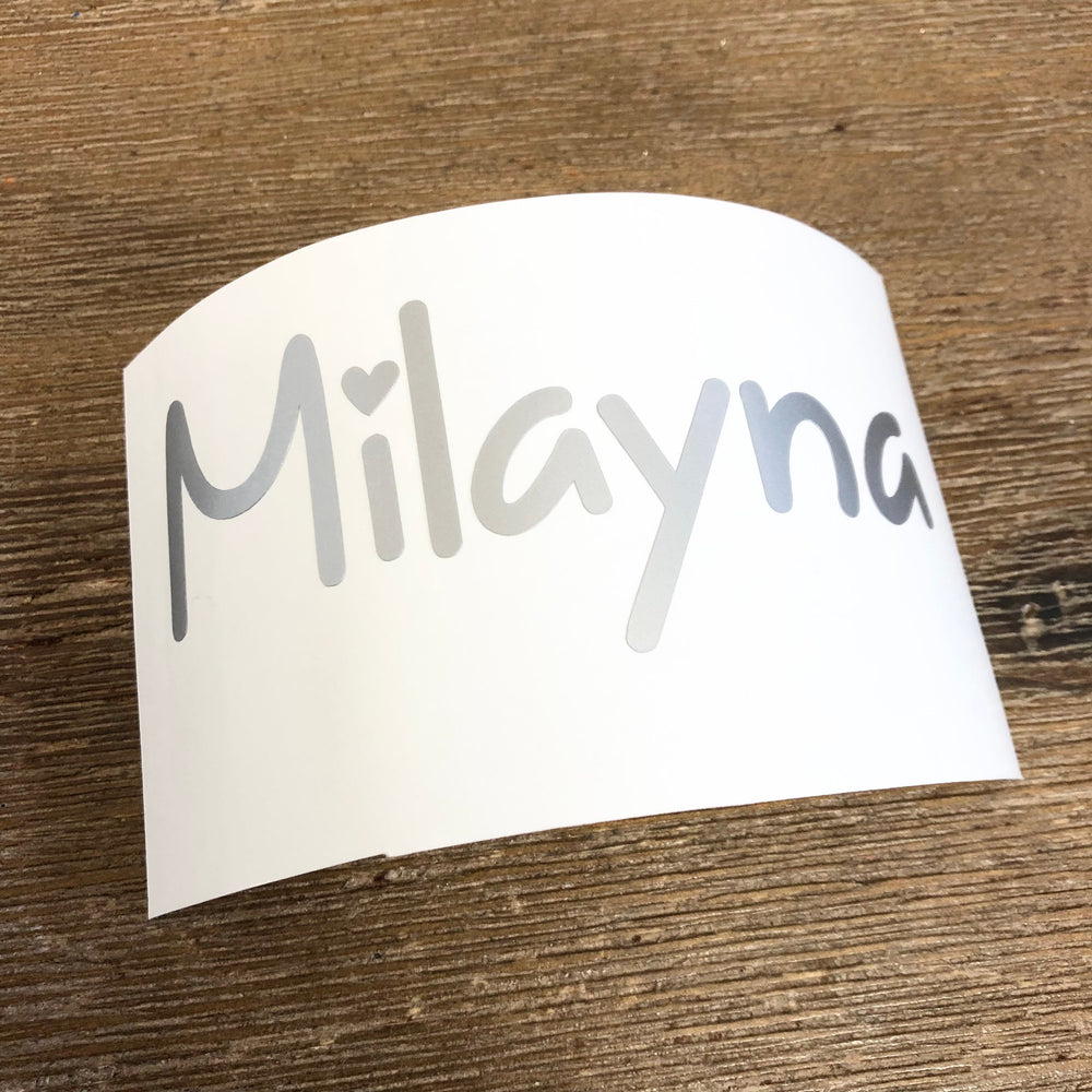 Grey Milayna name decal on curved backing