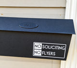 White No Soliciting No Flyers decal on a black mailbox